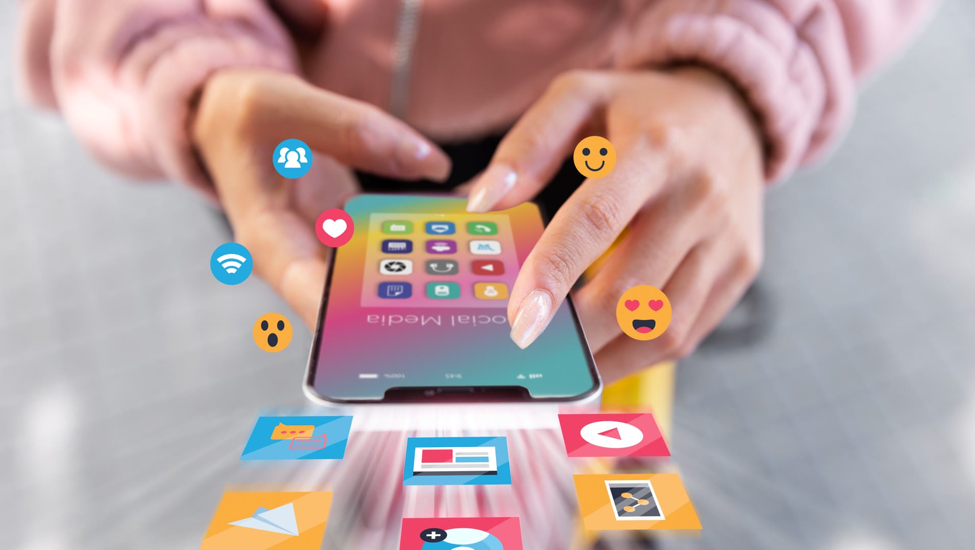 A person interacting with a smartphone displaying various social media icons.
