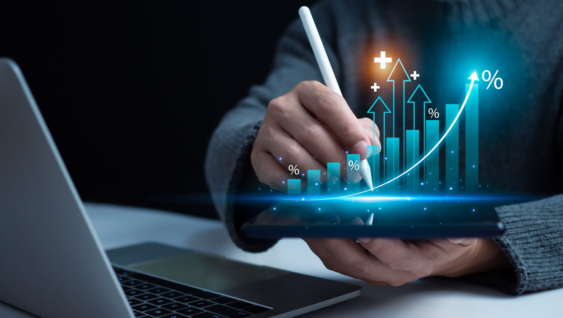 A person using a stylus on a tablet to analyze financial data with graphs.