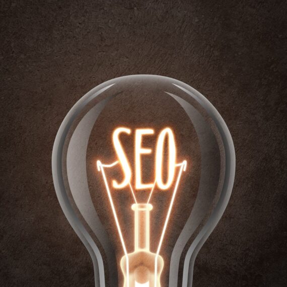 A sleek, modern website design displayed on a desktop computer, tablet, and smartphone, illustrating the responsive web design services offered by Solve Design Create. The image emphasizes the integration of SEO strategies into web design for enhanced online visibility.
