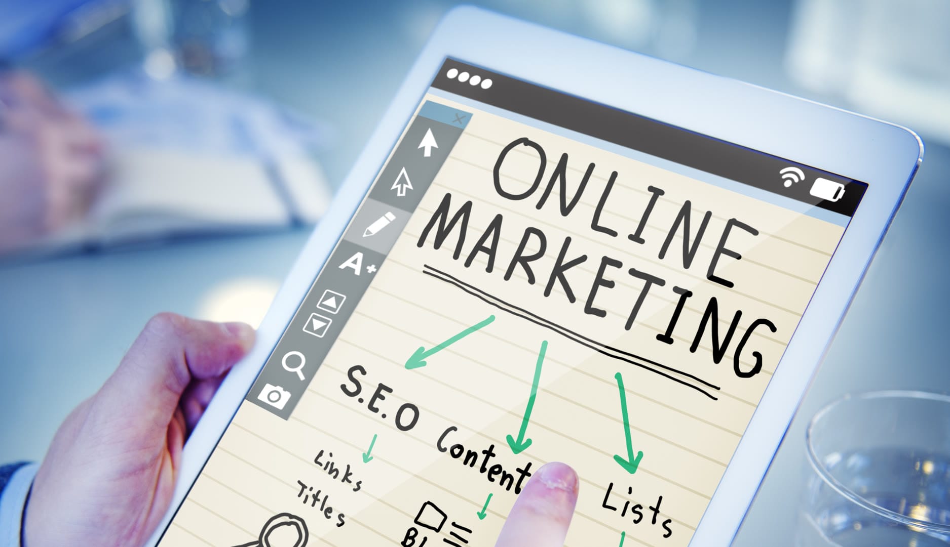A tablet displaying notes on online marketing strategies and SEO content.