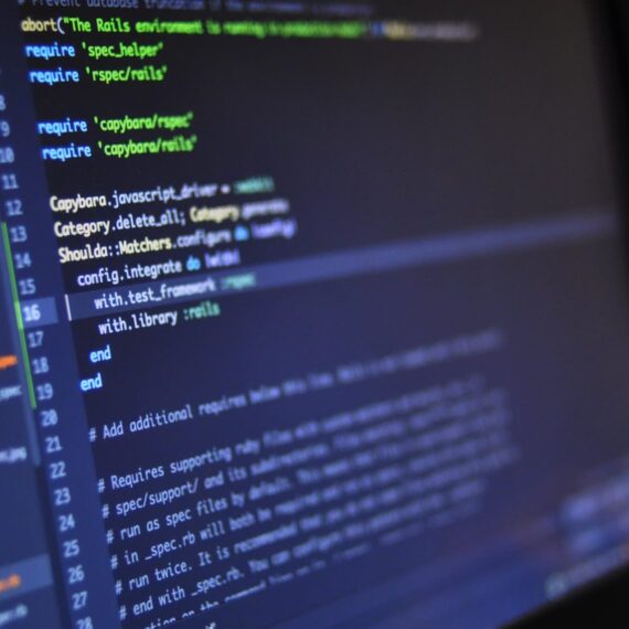 Close-up of code on a laptop screen, showcasing programming syntax and structure.