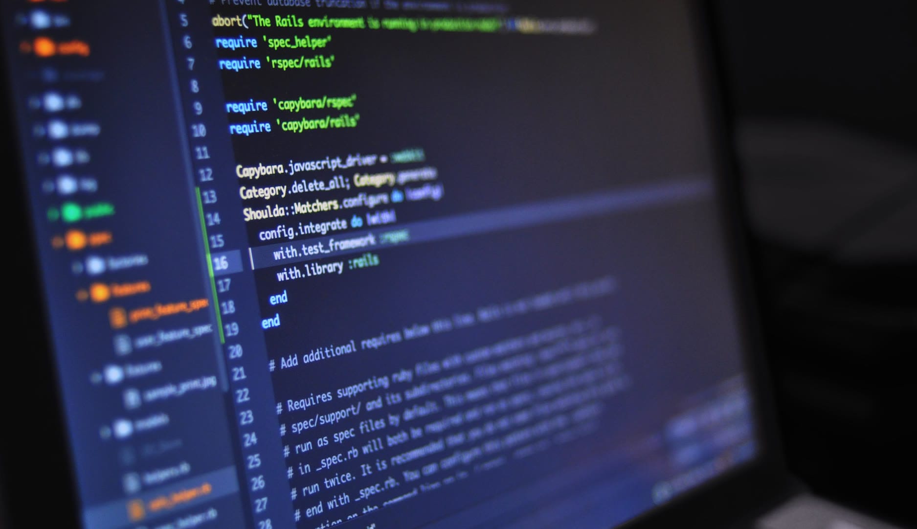 Close-up of code on a laptop screen, showcasing programming syntax and structure.