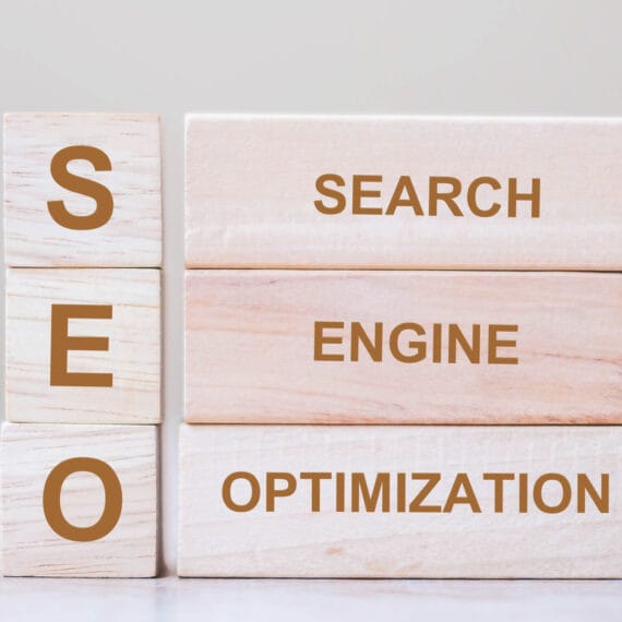 Wooden blocks displaying the words SEO, Search, Engine, and Optimization.