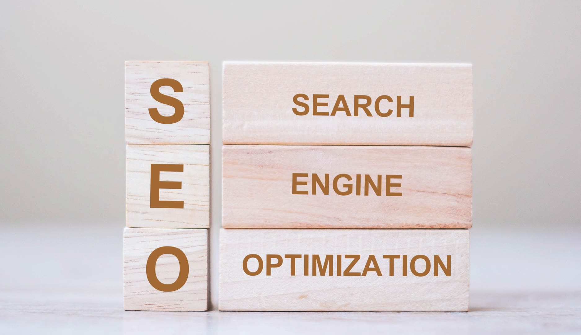 Wooden blocks displaying the words SEO, Search, Engine, and Optimization.
