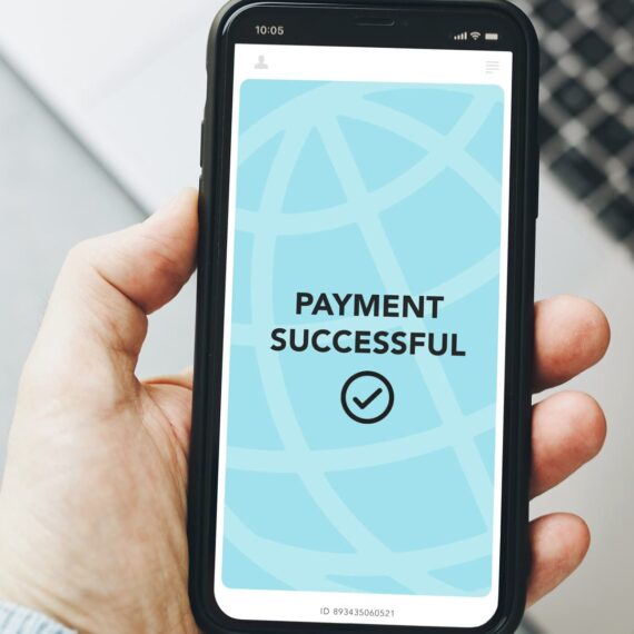 A smartphone displaying a 'Payment Successful' notification with a checkmark.
