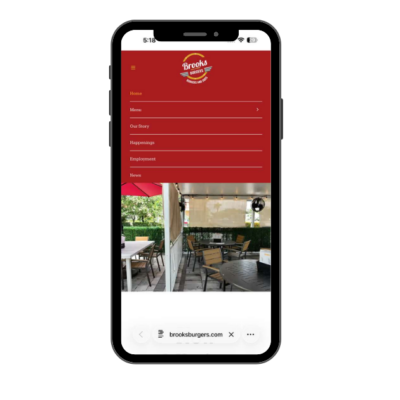 Mobile app interface showcasing a burger restaurant's menu and outdoor seating area.