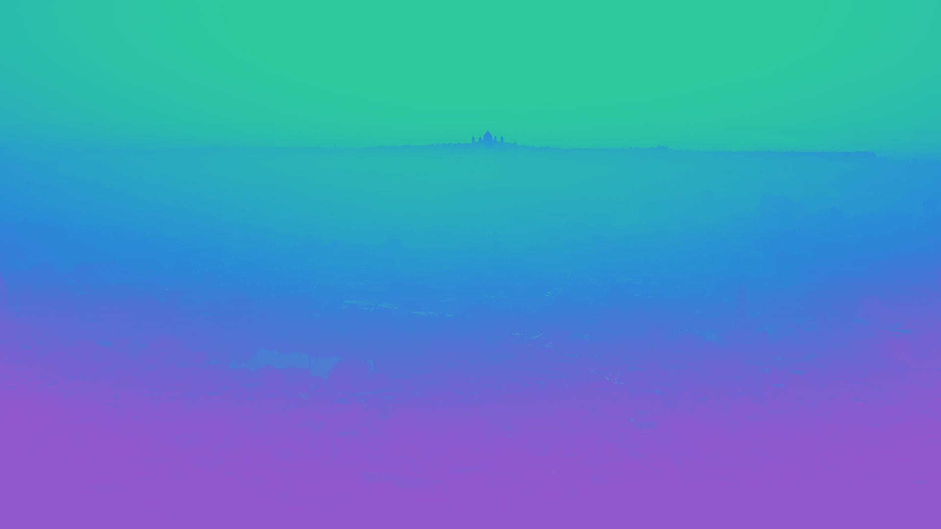 A gradient landscape with a misty horizon blending blue and purple hues.